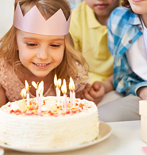 Happy kids birthday party celebration in a rustic cozy nature park lodge party room